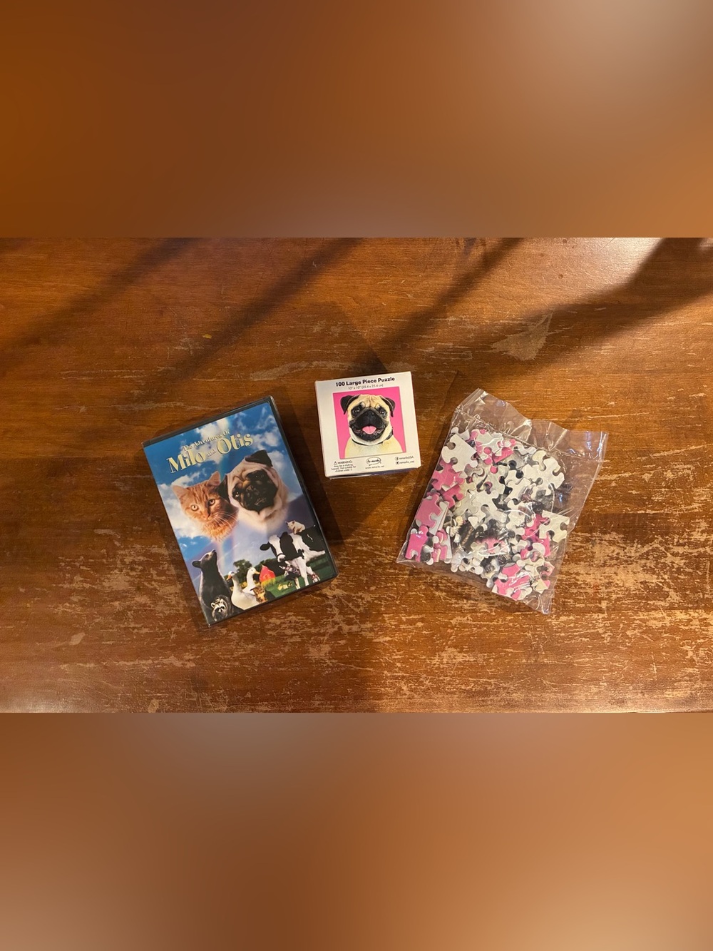 The Adventures of Milo & Otis DVD & Re-Marks 100 Piece Pug Puzzle. Both New. $5
